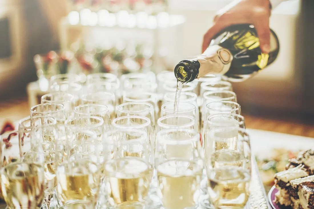 Champagne poured into a tray of glasses