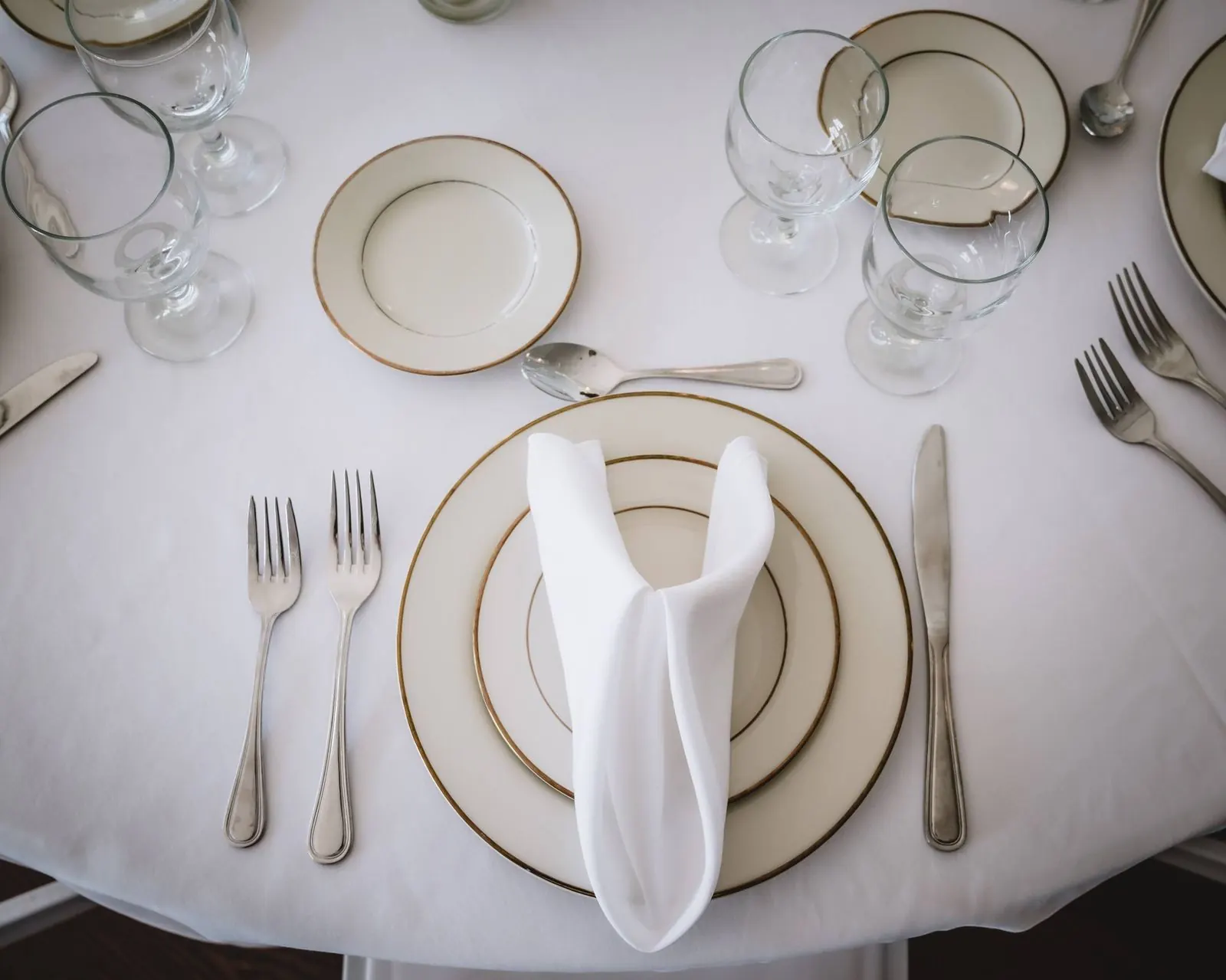 Place setting on a white tablecloth